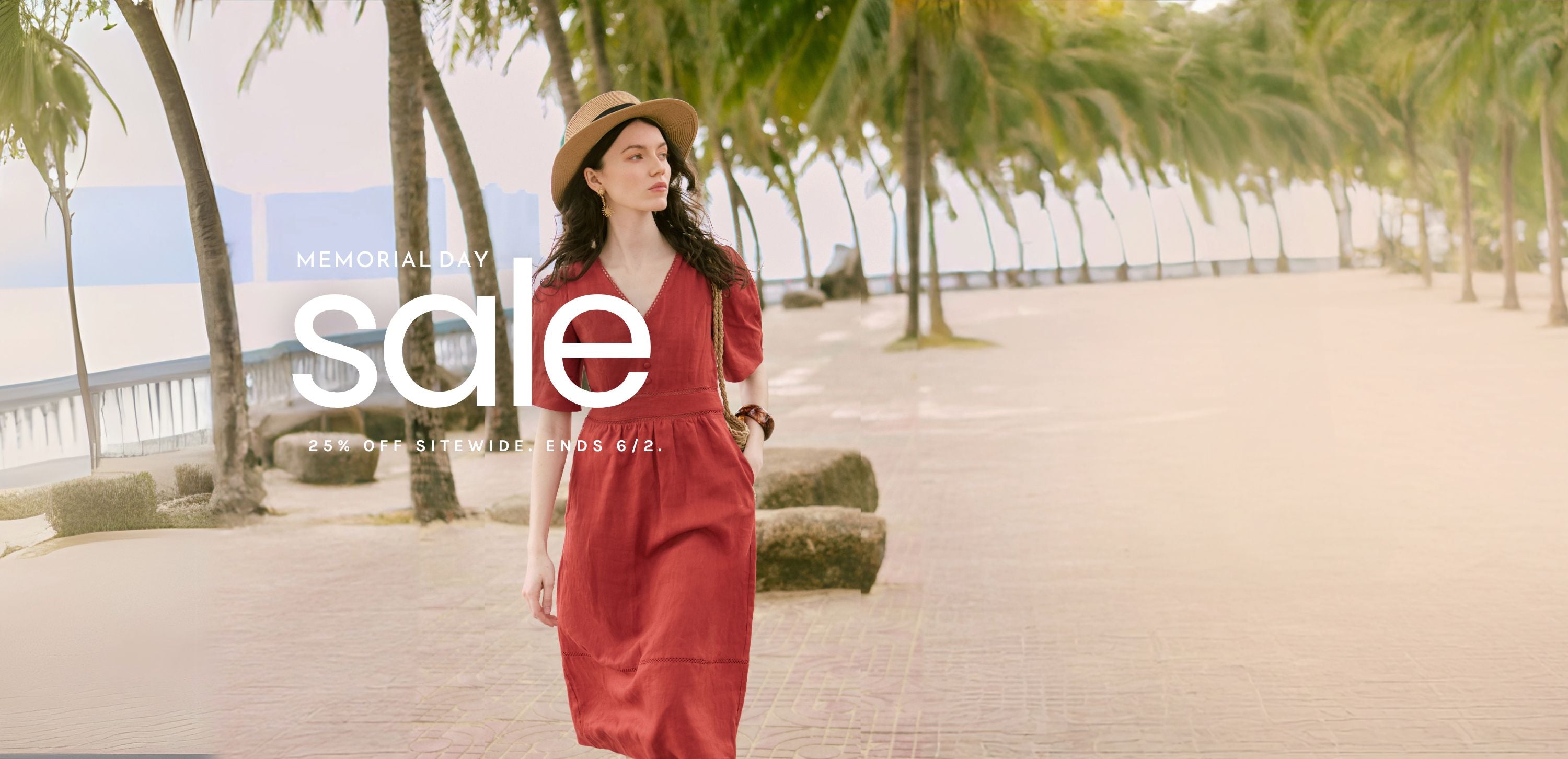 Petite woman walking by the water in a Petite Studio dress