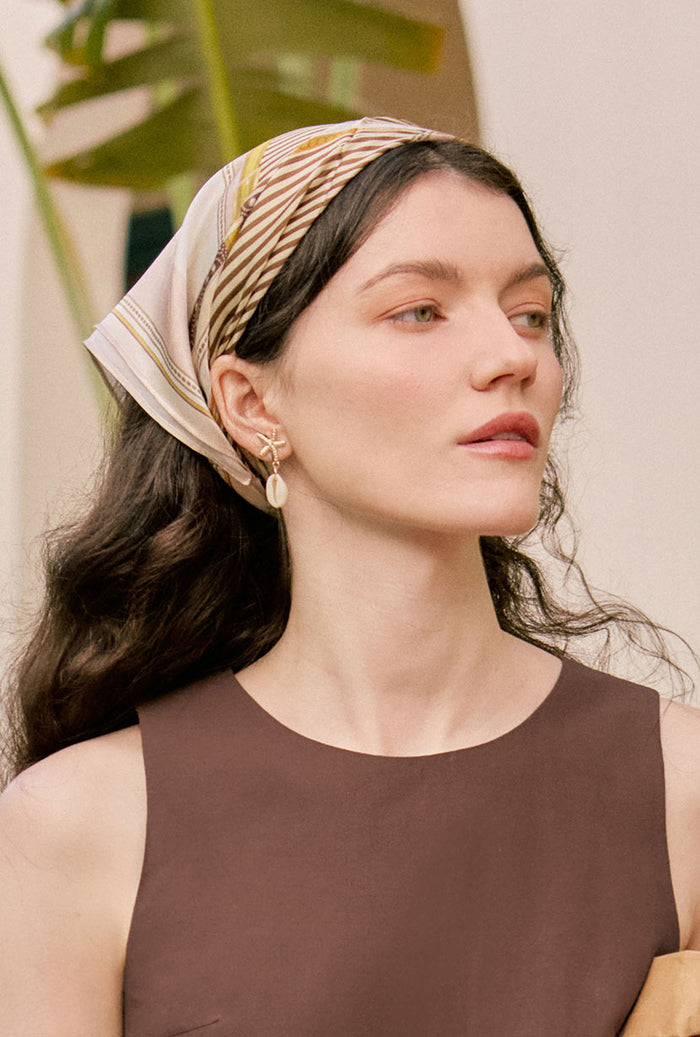Petite Studio's Gold Starfish and Cowrie Shell Drop Earrings 