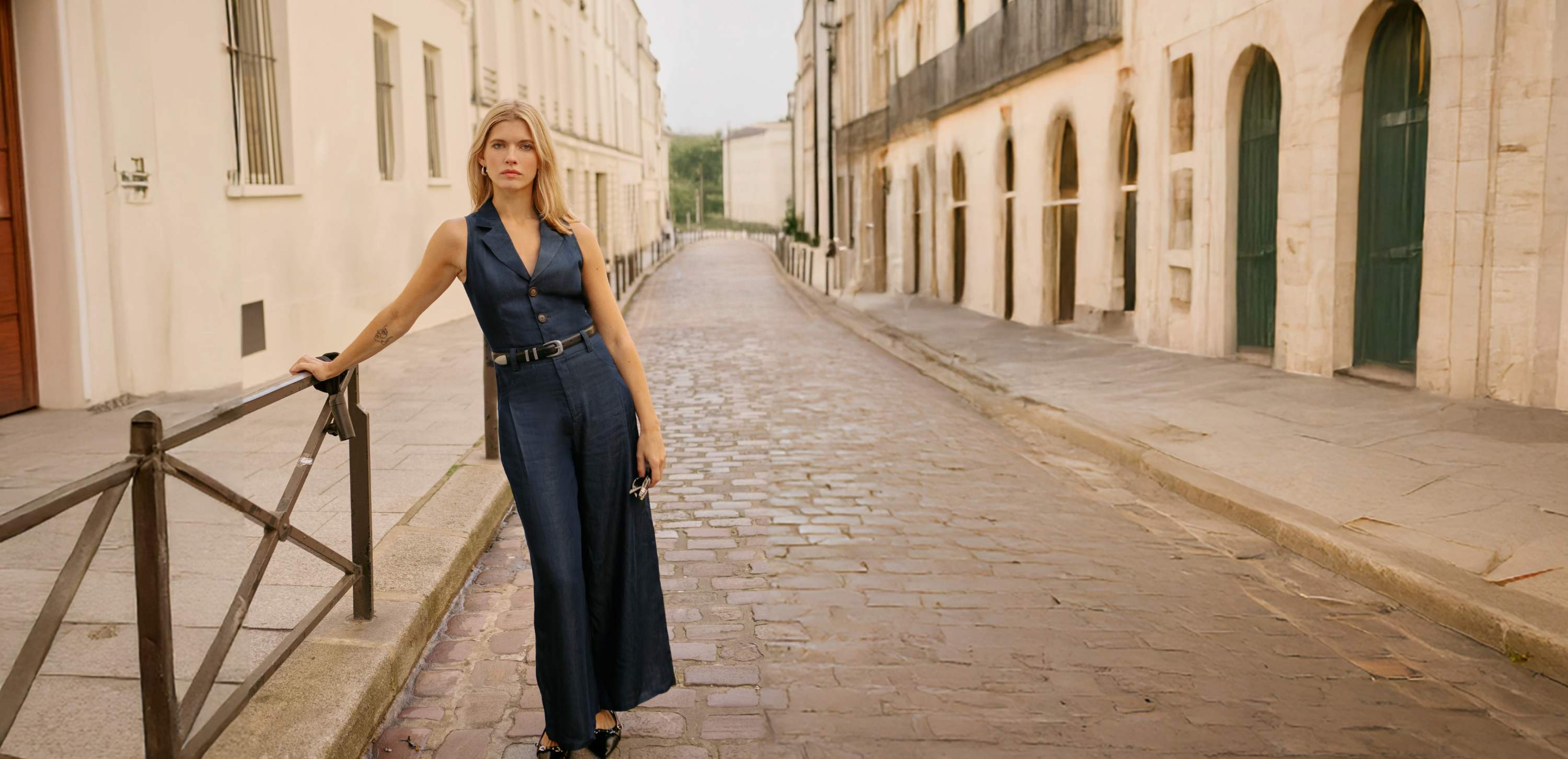 Petite model walking on the streat wearing Petite Studio Mitzi jumpsuit